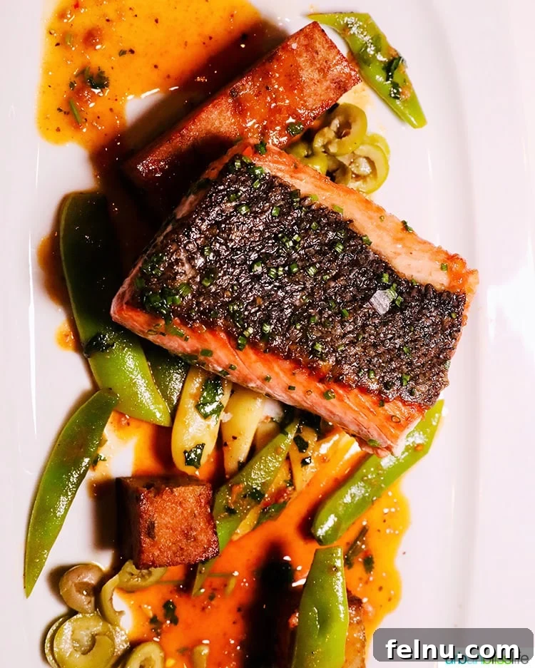 Celebrate in Style: Portland's Finest Restaurants 14 Perfectly seared salmon at Ringside Steakhouse in Portland, featuring crisp skin and tender flesh.