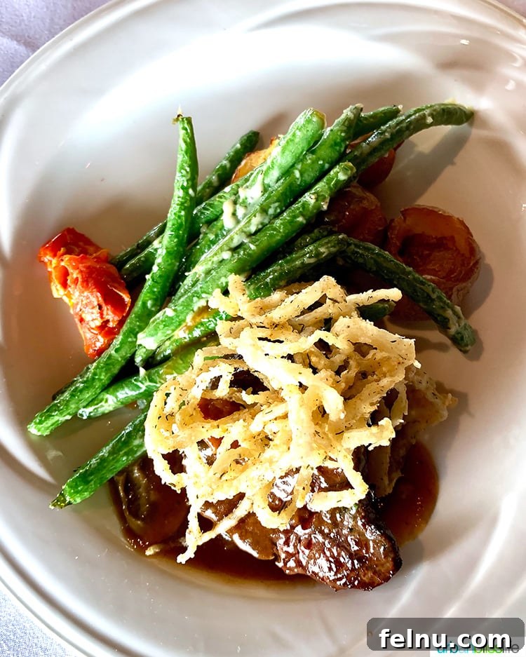 Celebrate in Style: Portland's Finest Restaurants 35 A perfectly cooked steak served at Portland City Grill, exemplifying classic American cuisine.