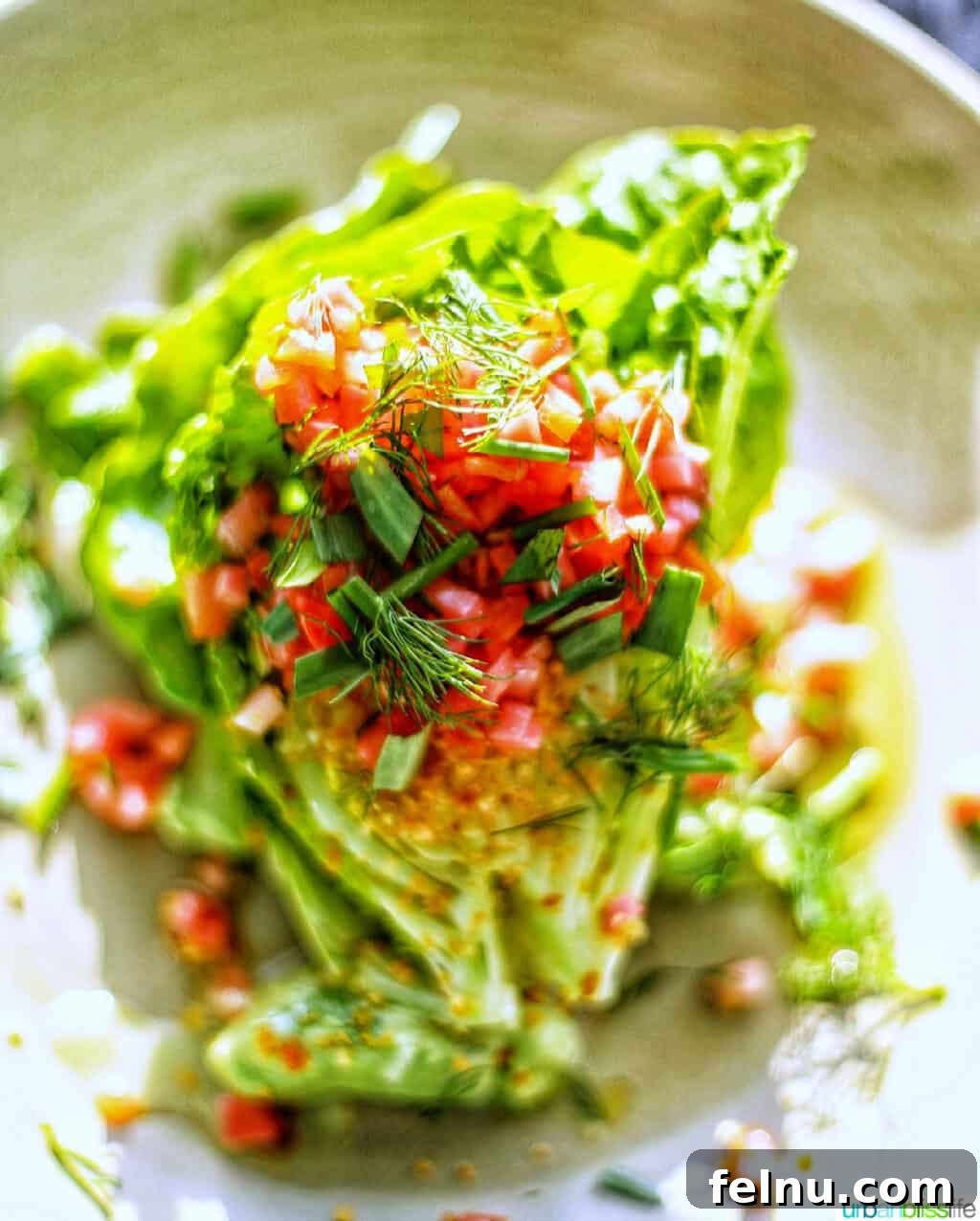 Celebrate in Style: Portland's Finest Restaurants 37 A vibrant wedge salad at Le Pigeon restaurant in Portland, Oregon, showcasing fresh ingredients and elegant dressing.