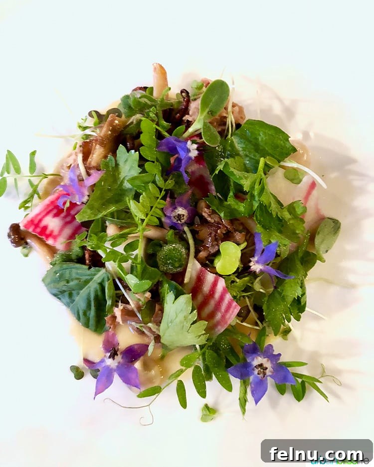 Celebrate in Style: Portland's Finest Restaurants 8 Vibrant Yum Pai salad at Langbaan, bursting with fresh ingredients.