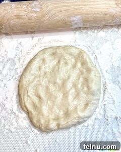 Emerald Ocean Pizza 7 easy pizza dough being rolled out