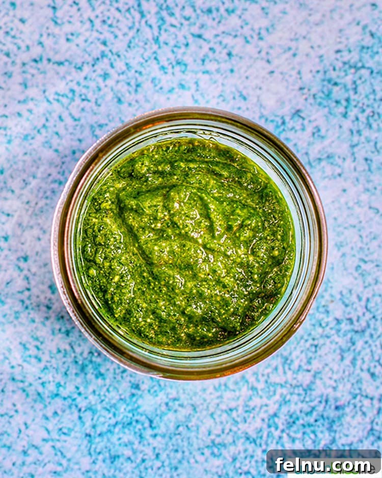 Effortless Spinach Pesto 3 A jar of homemade spinach pesto, ready for use or storage.