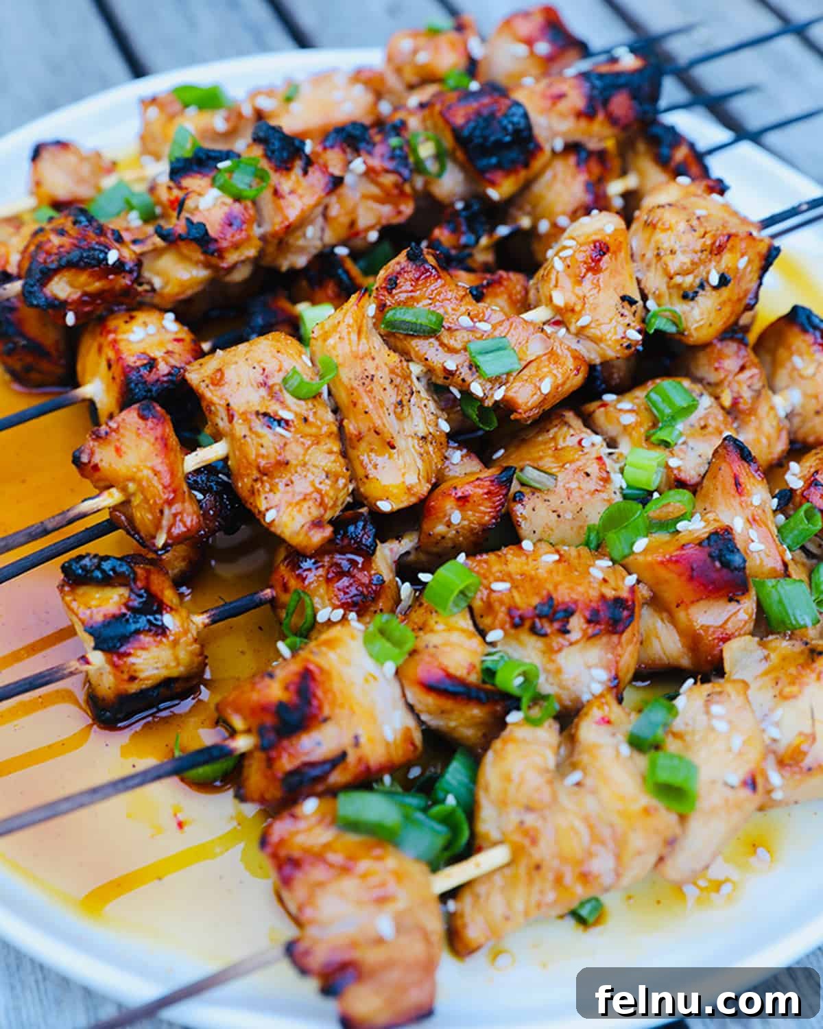Honey Garlic Chicken Kebabs 2 Grilled Honey Garlic Chicken Skewers on a Platter