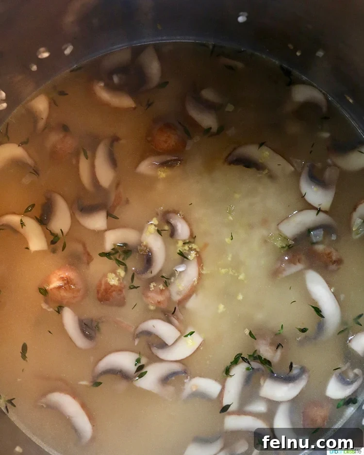 Mushroom Magic: Creamy Vegan Risotto in Minutes 9 Vegetable broth being poured into an Instant Pot with rice and mushrooms.