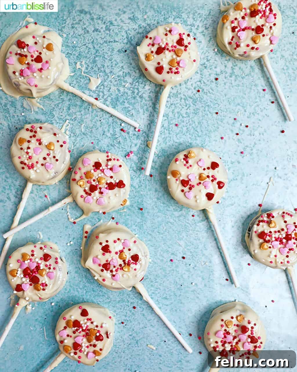 Valentine's Day Oreo Delights 4 Valentine's Day OREO Pops - A flatlay showing the completed pops and decorations.