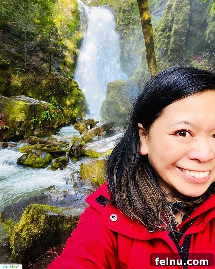 Susan Creek Falls Southern Oregon Gem 12 Marlynn Schotland posing happily at the base of Susan Creek Falls, enjoying the refreshing spray of the waterfall in Southern Oregon