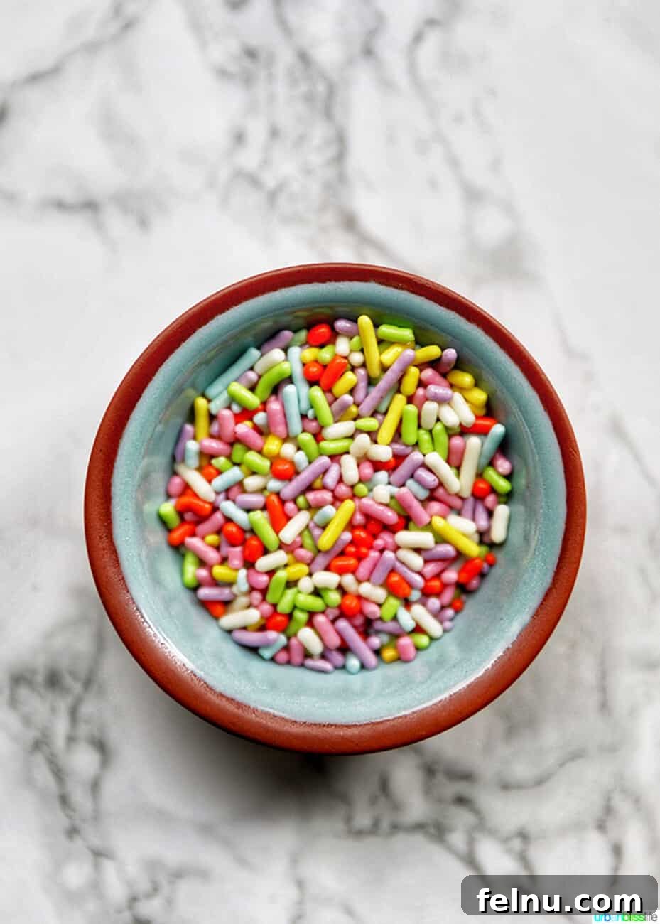 Chocolate Covered Peanut Butter Ritz Bites 4 Colorful sprinkles in a bowl