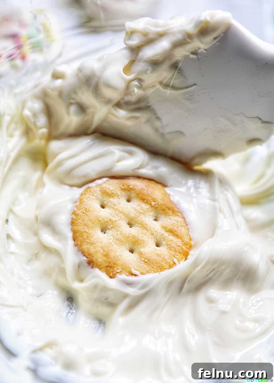 Chocolate Covered Peanut Butter Ritz Bites 5 Dipping Ritz cracker cookies into white chocolate