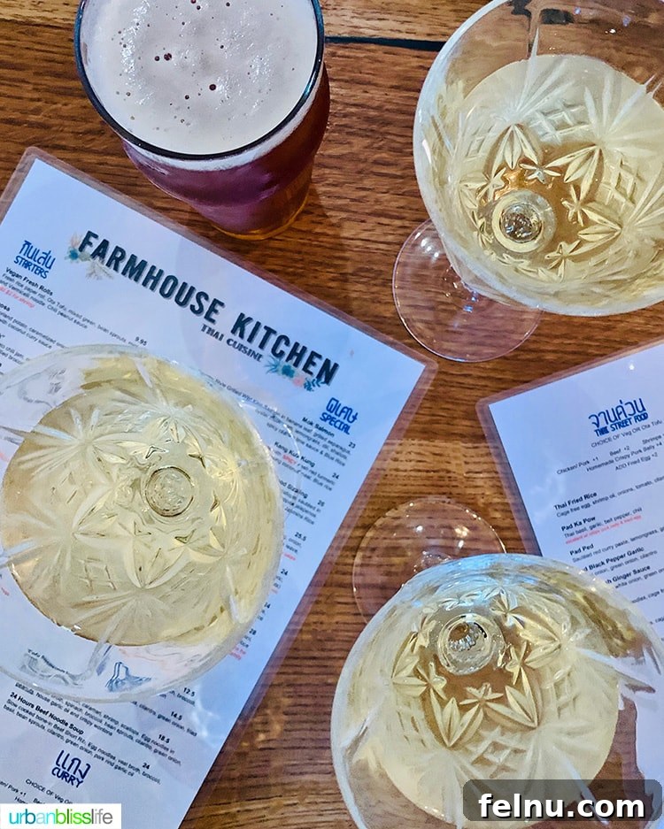 Portland's Farmhouse Table 12 Elegantly presented wine glass, suggesting thoughtful wine pairings for the flavorful Thai cuisine at Farmhouse Kitchen Portland.