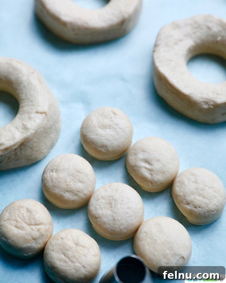 Effortless Air Fryer Doughnuts 5 cutting holes in biscuit dough