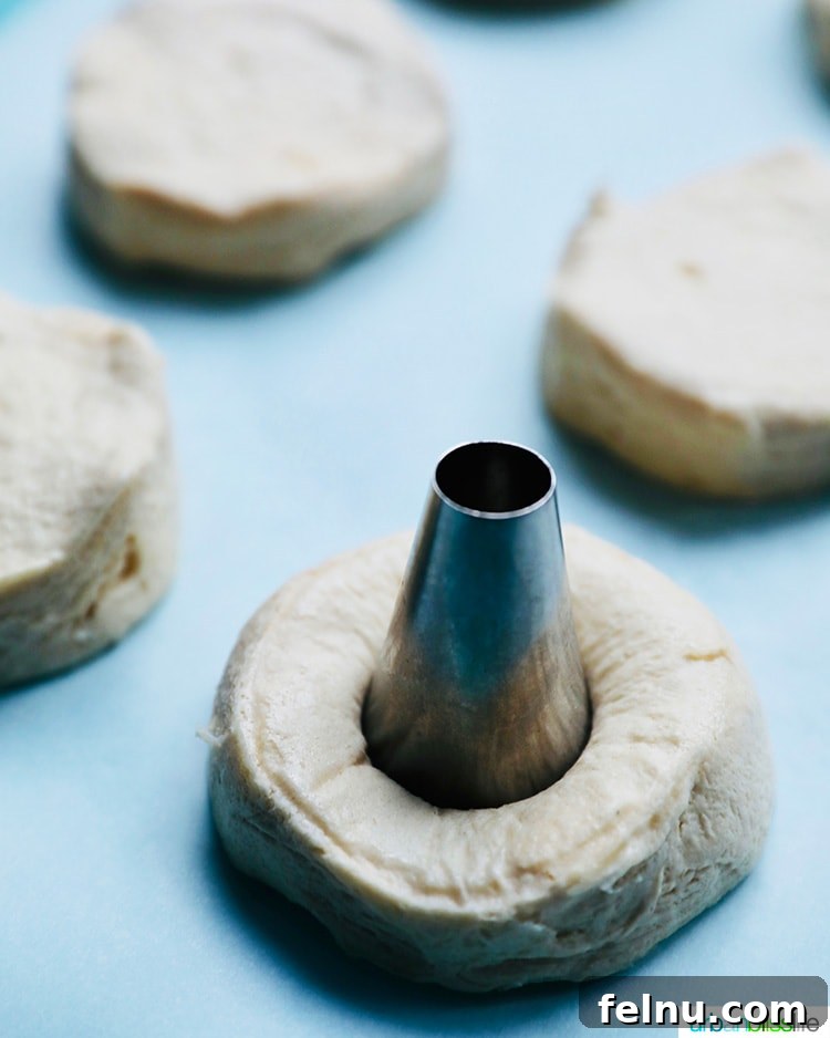 Effortless Air Fryer Doughnuts 6 cutting donut holes in dough for air fryer donuts
