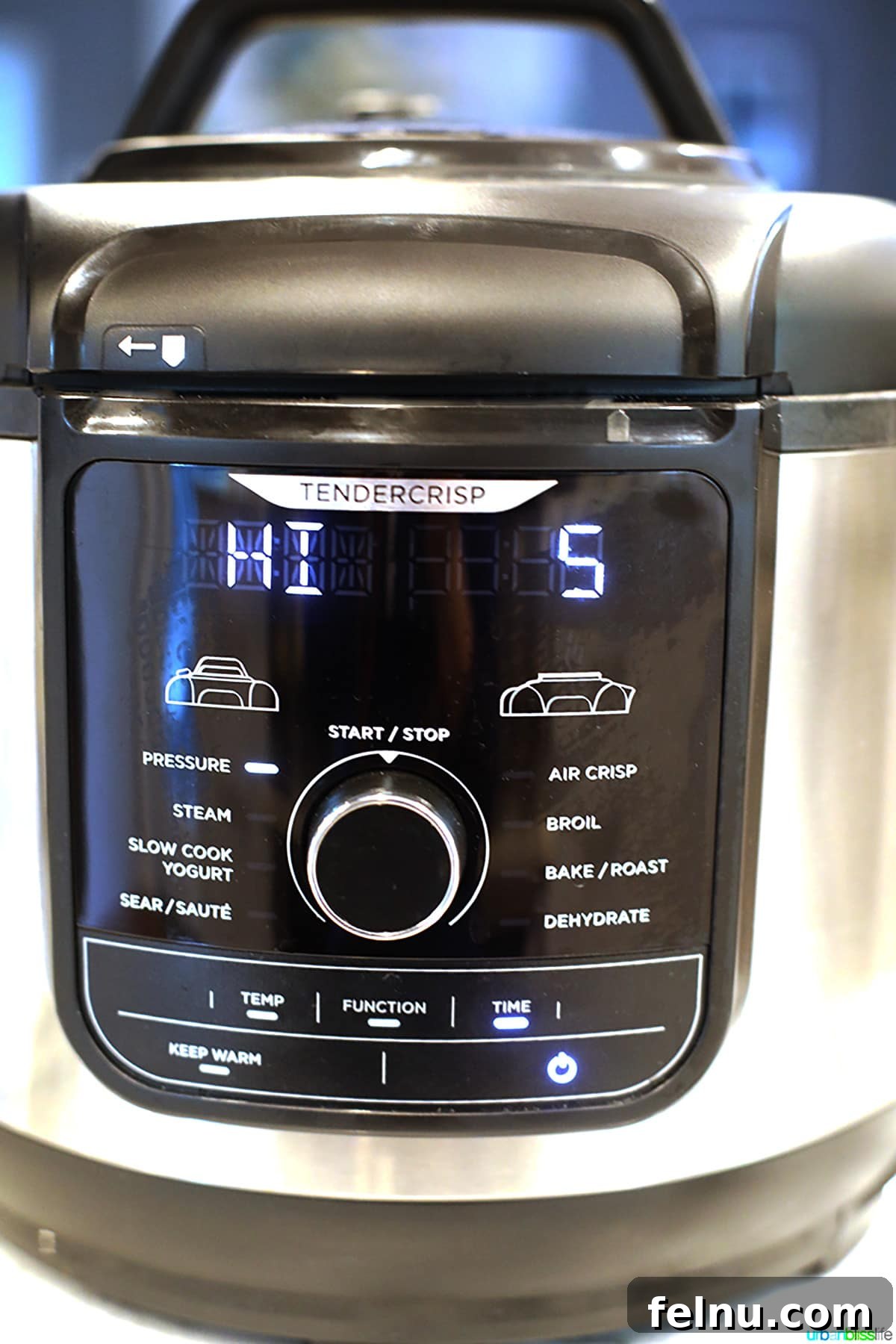 A Ninja Foodi pressure cooker set to HI for 5 minutes, illustrating the equipment needed for the recipe.