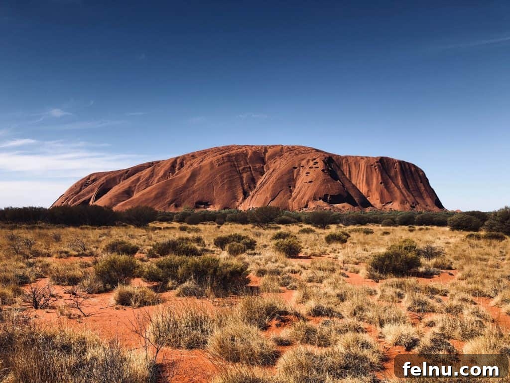 20 Virtual Journeys From The Comfort Of Your Home 20 The monumental sandstone formation of Uluru at sunset, changing colors dramatically
