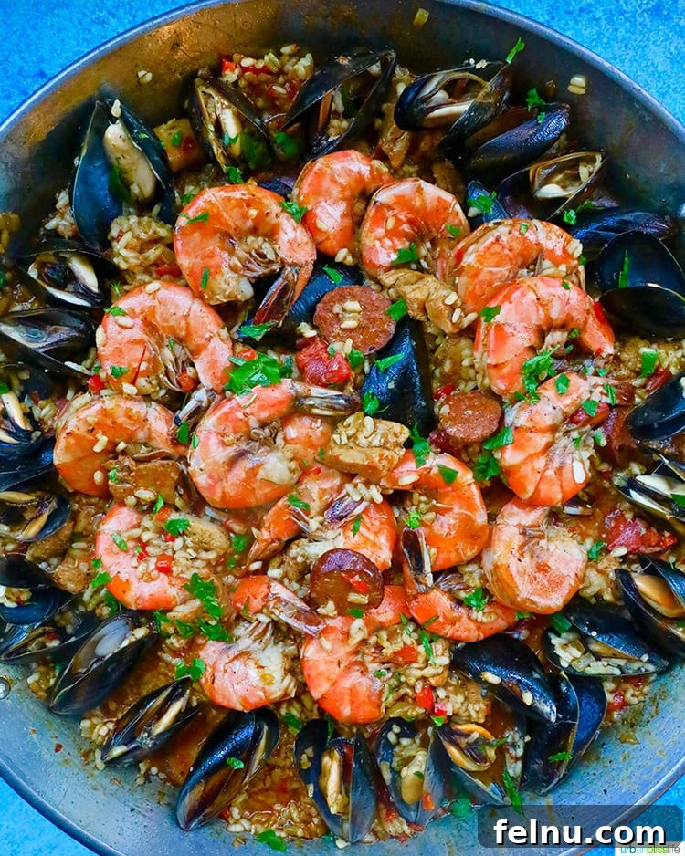 Family-Friendly Dinner Delights: 110 Simple & Delicious Recipes 15 closeup of full pan of seafood paella