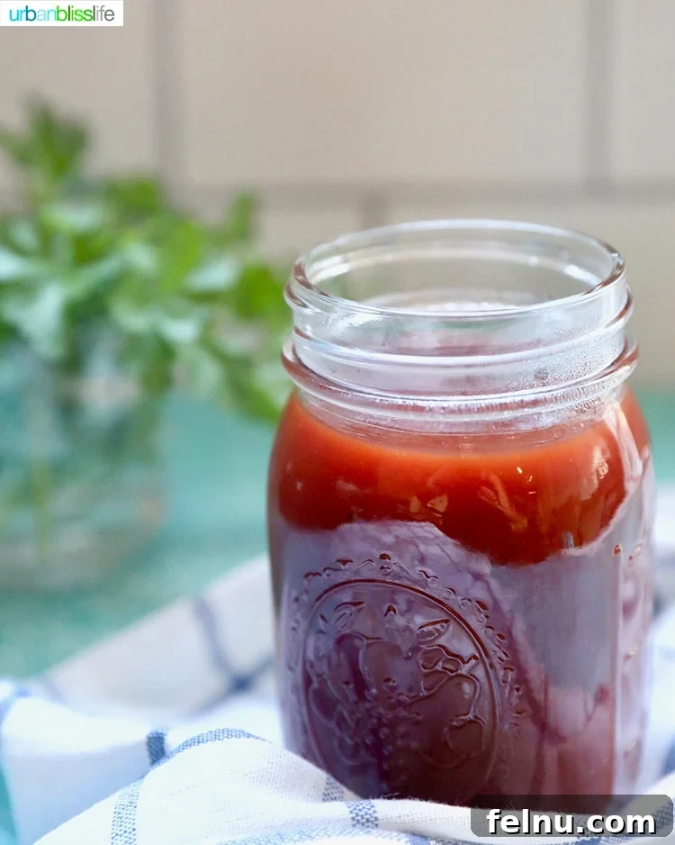 Sticky Sweet BBQ Perfection 4 A mason jar filled with rich, homemade sweet BBQ sauce, ready for use.