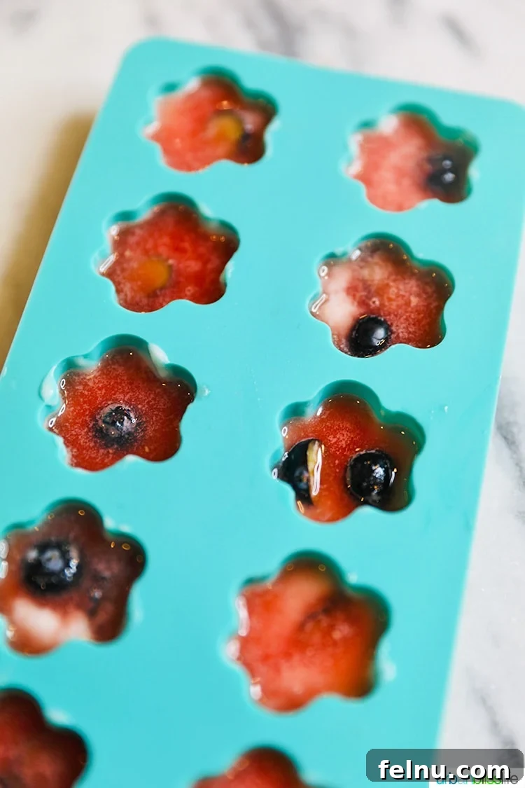 Frozen Watermelon Blueberry Yogurt Dog Treats
Summer Pawsicles: Watermelon Blueberry Yogurt Delights 11 Frozen watermelon dog treats in a silicone mold