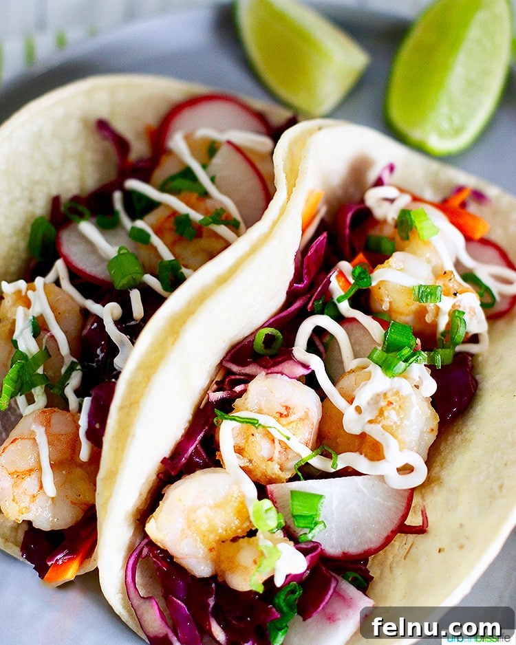 A close-up of a single Easy Shrimp Taco, showcasing fresh ingredients