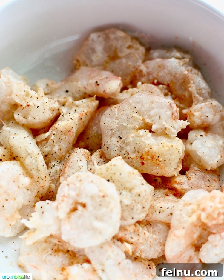 Raw shrimp seasoned and ready to cook for tacos