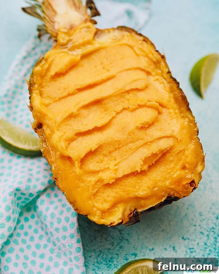 Pineapple Mango Sorbet served in a hollowed out pineapple