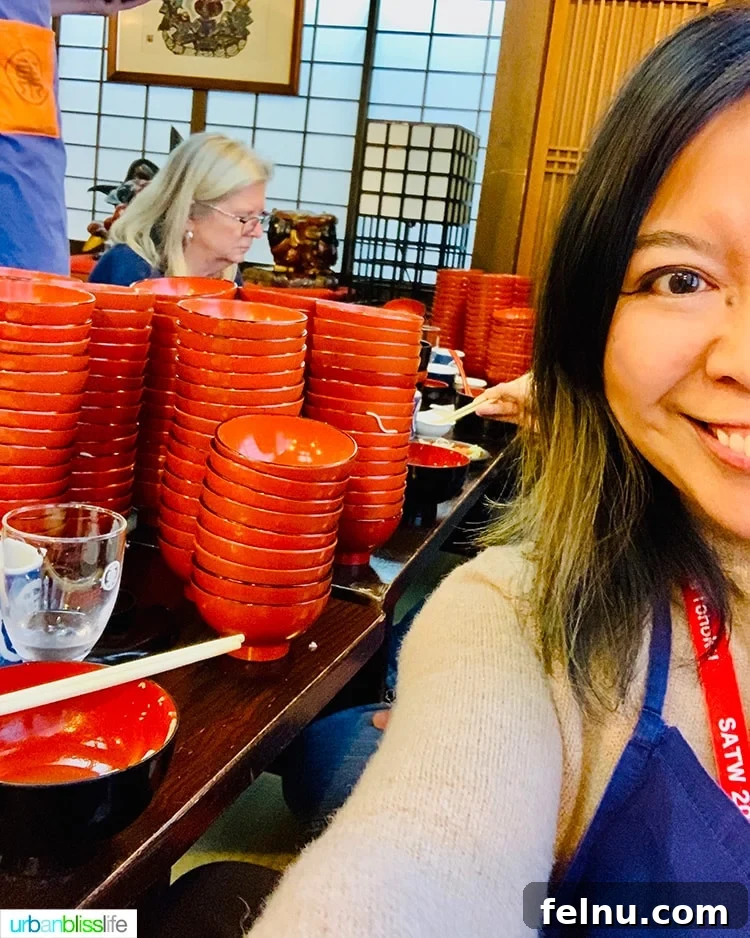 The Endless Noodles of Morioka: A Wanko Soba Adventure 11 A participant posing with stacks of Wanko Soba noodle bowls
