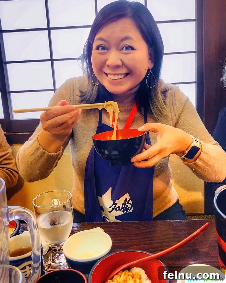 The Endless Noodles of Morioka: A Wanko Soba Adventure 7 A participant enjoying a bowl of Wanko Soba noodles