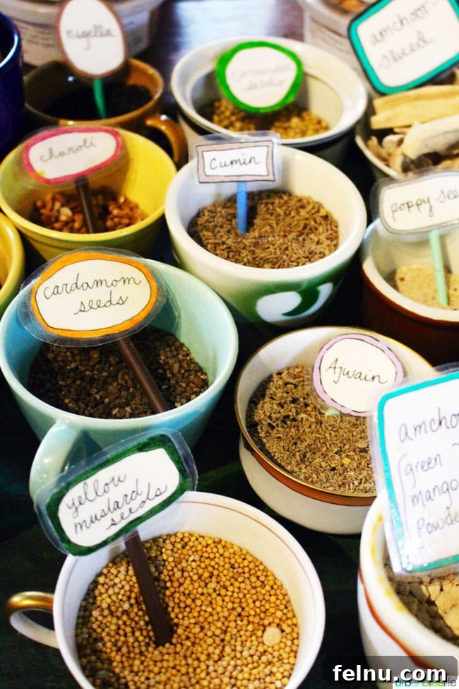Bollywood Extravaganza 6 An array of fresh, vibrant spices in open containers at Bollywood Theater, highlighting their commitment to scratch-made ingredients