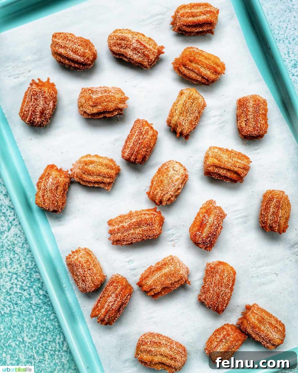 Perfectly cooked churros sprinkled with cinnamon sugar, ready to be served.