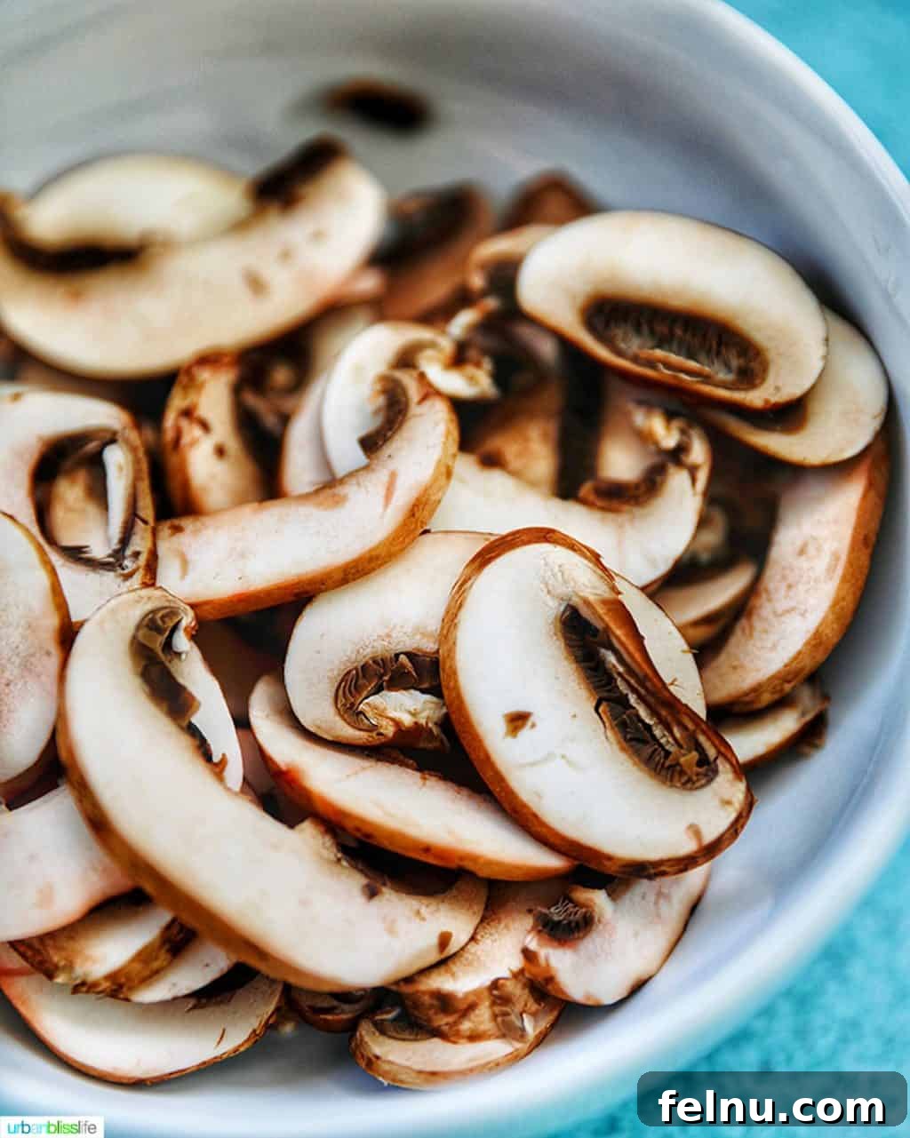 Creamy Coconut Curry Shrimp and Mushroom Medley 8 Freshly sliced cremini mushrooms on a cutting board