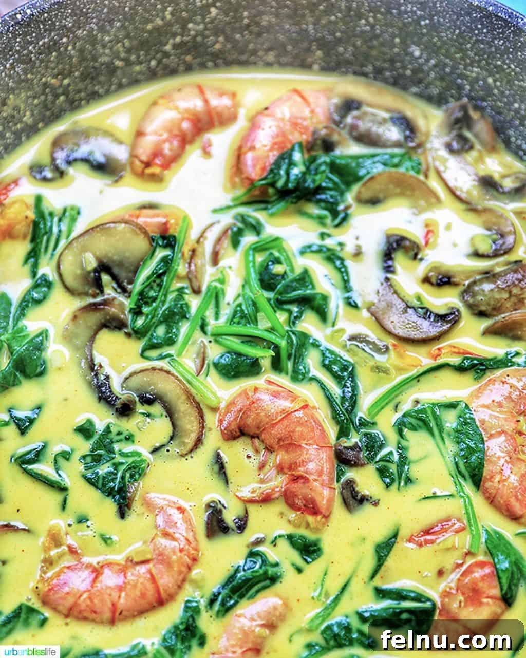 Creamy Coconut Curry Shrimp and Mushroom Medley 9 Coconut shrimp curry simmering in a wide skillet