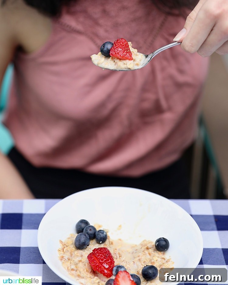 Elevate Your Everyday with Ultra-Filtered Milk 5 A spoonful of wholesome oatmeal topped with fresh fruit, ready to be enjoyed with ultra-filtered milk.