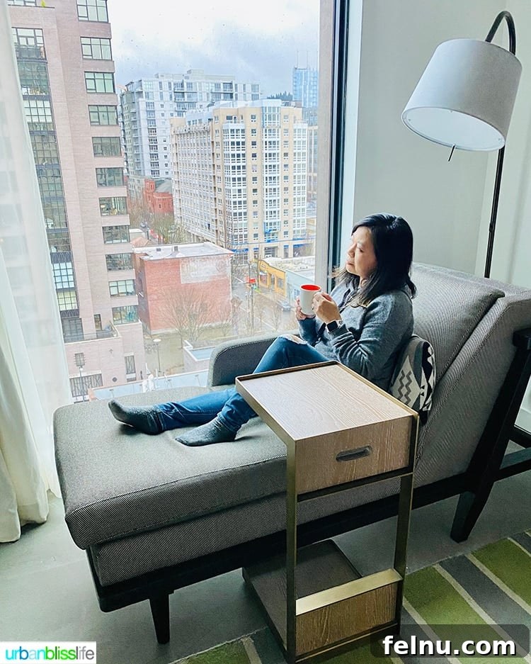 Canopy Portland: Your Pearl District Retreat 13 Guest Enjoying Window Seat