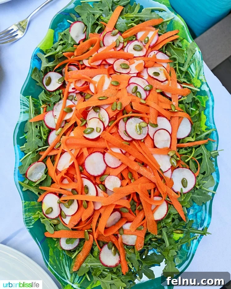 Zesty Radish Carrot Slaw 3 Full serving plate of Radish Carrot Arugula Salad, showcasing its vibrant colors.