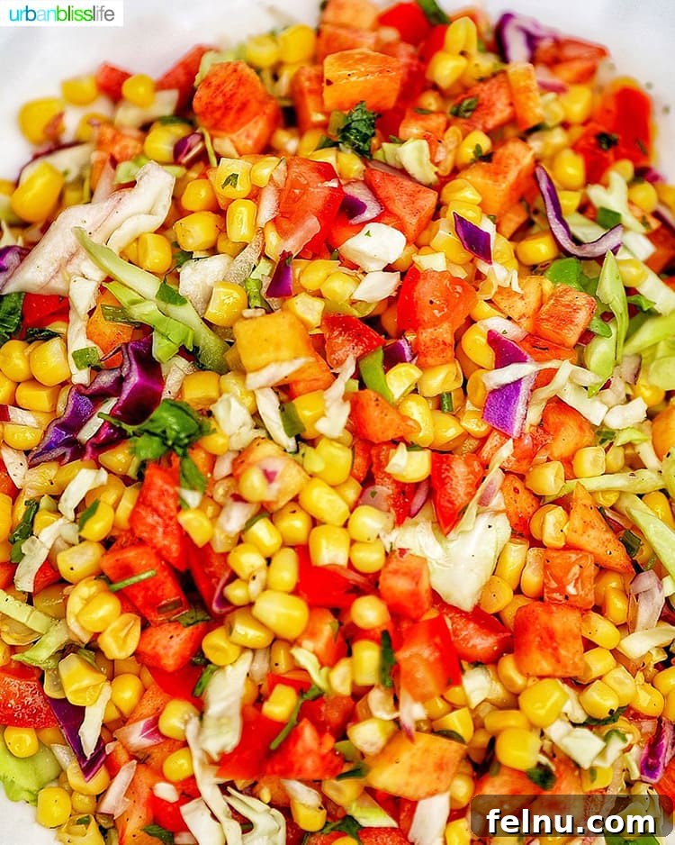 Sun-Kissed Slaw: Peaches, Corn & Tomatoes 5 A close-up shot of the vibrant Summer Slaw, showcasing the colorful ingredients mixed together.