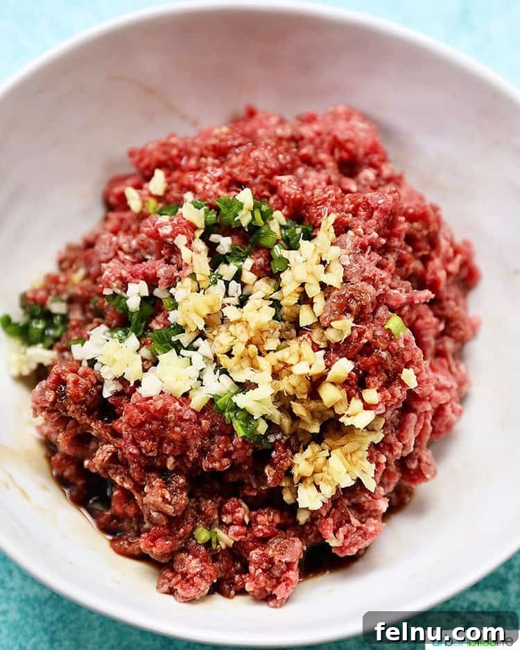 The asian burger ingredients mixed together in a large bowl.