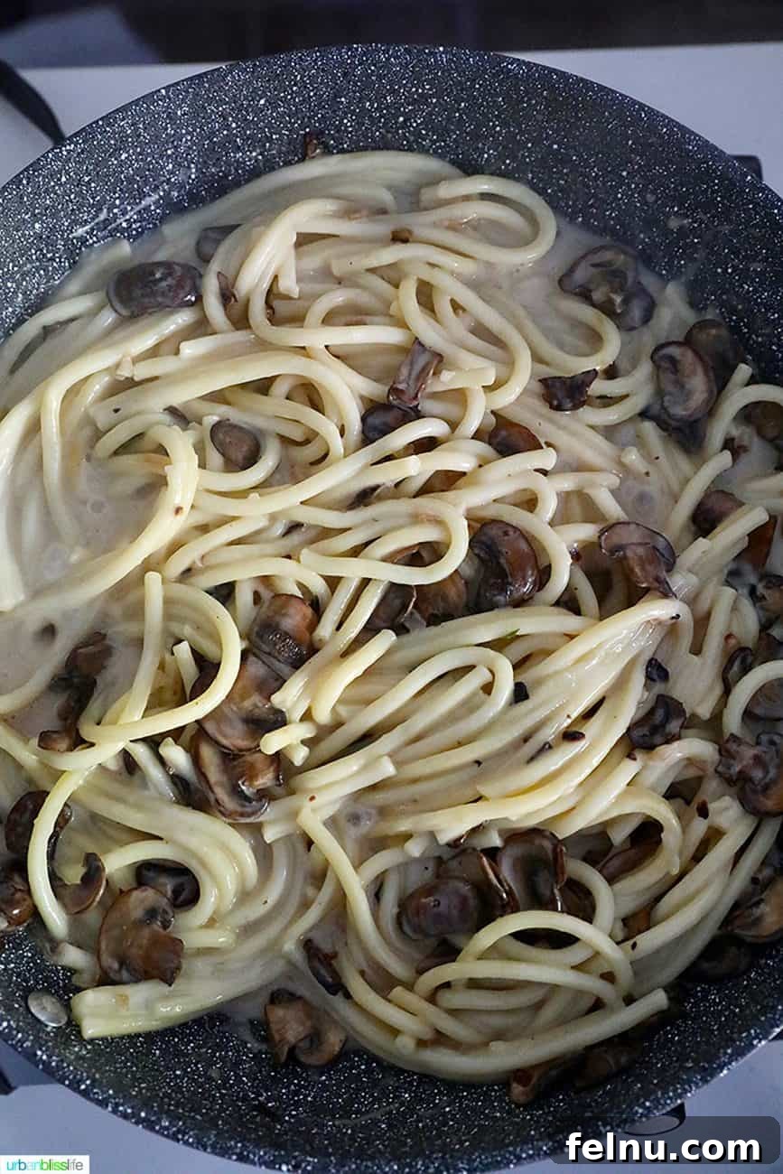 Adding Cream to Pasta and Mushrooms