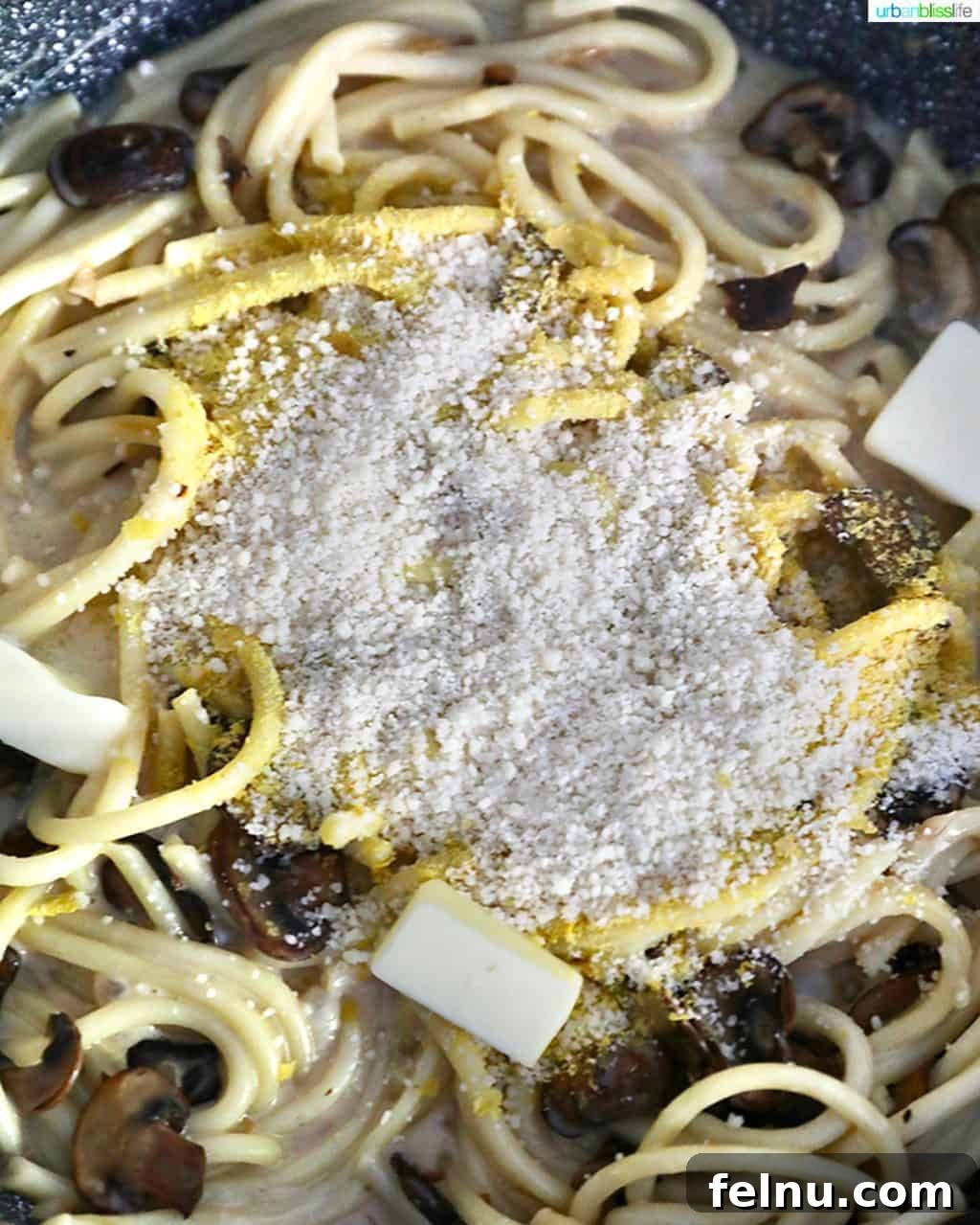 Adding Parmesan to Pasta and Mushrooms