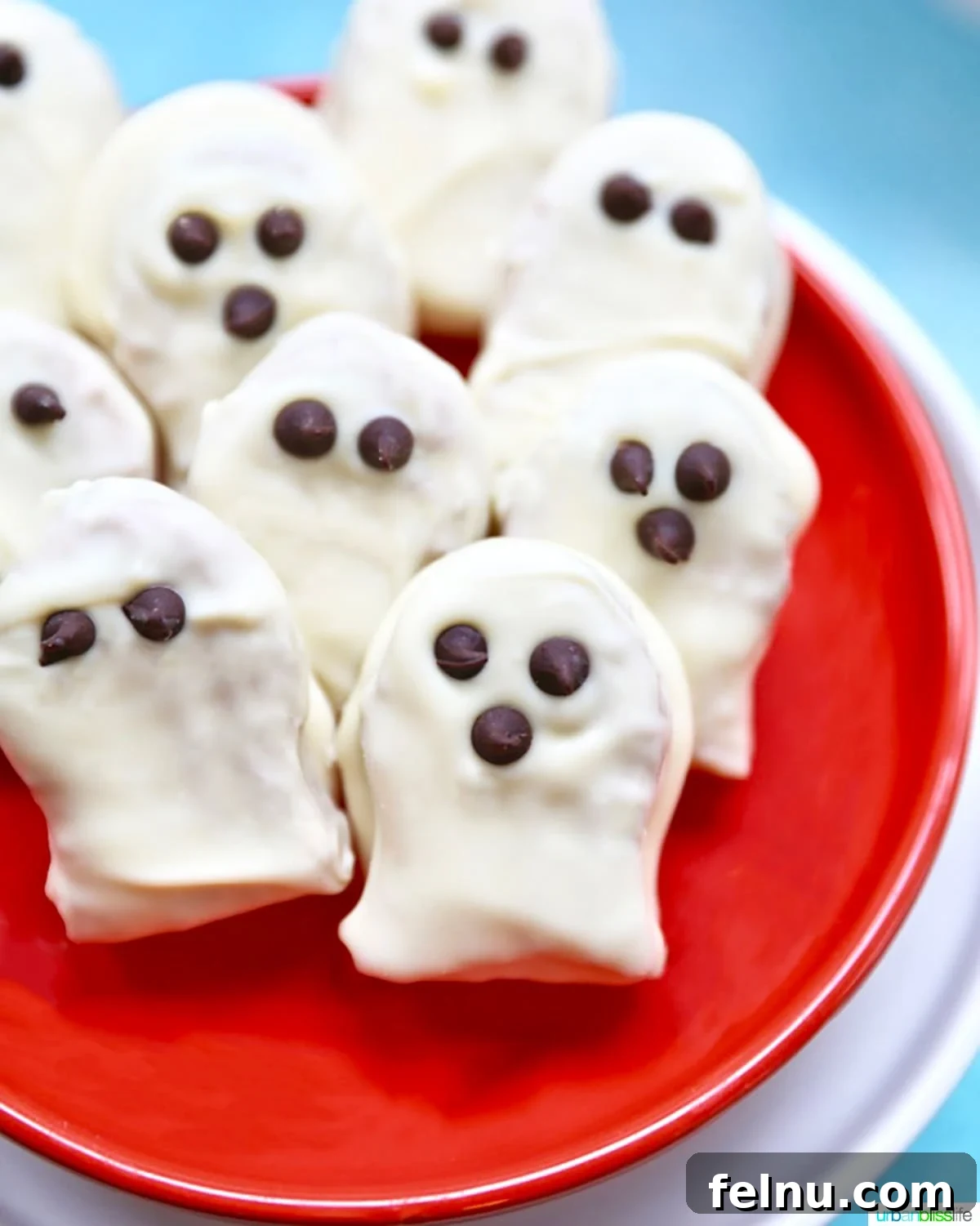 Spooky Nutter Butter Ghosts 2 Nutter Butter Ghost Cookies on an orange plate
