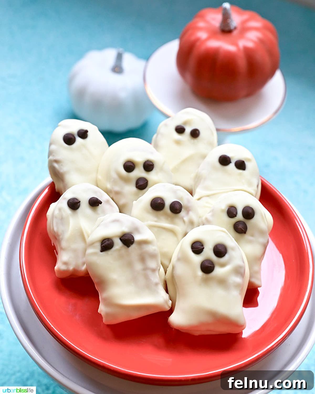 Spooky Nutter Butter Ghosts 3 Plate of Nutter Butter Ghost Cookies with pumpkins in the background