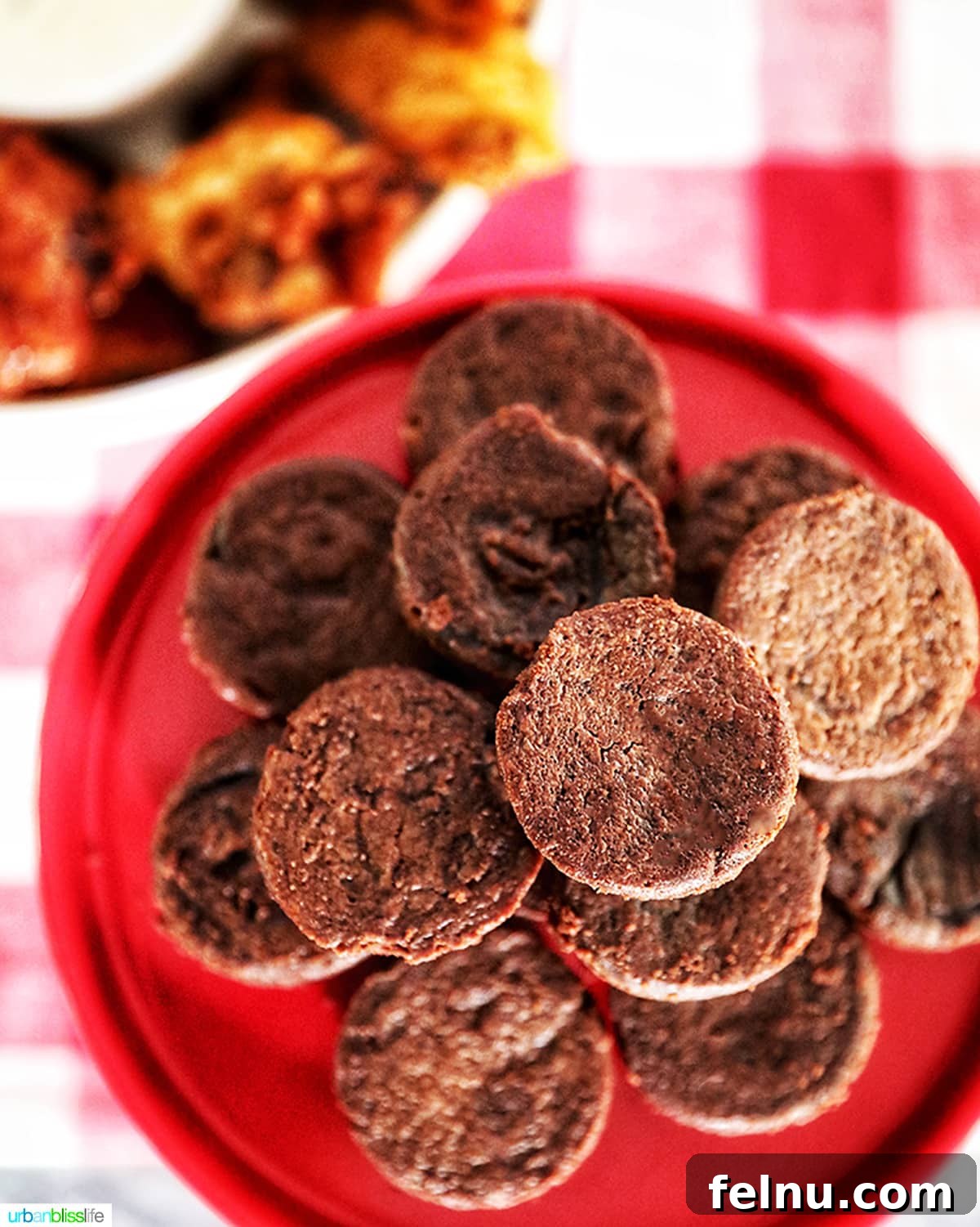 Ultimate Tailgate Grub Guide 8 A plate of decadent brownie bites, showcasing their rich chocolate color and fudgy texture.