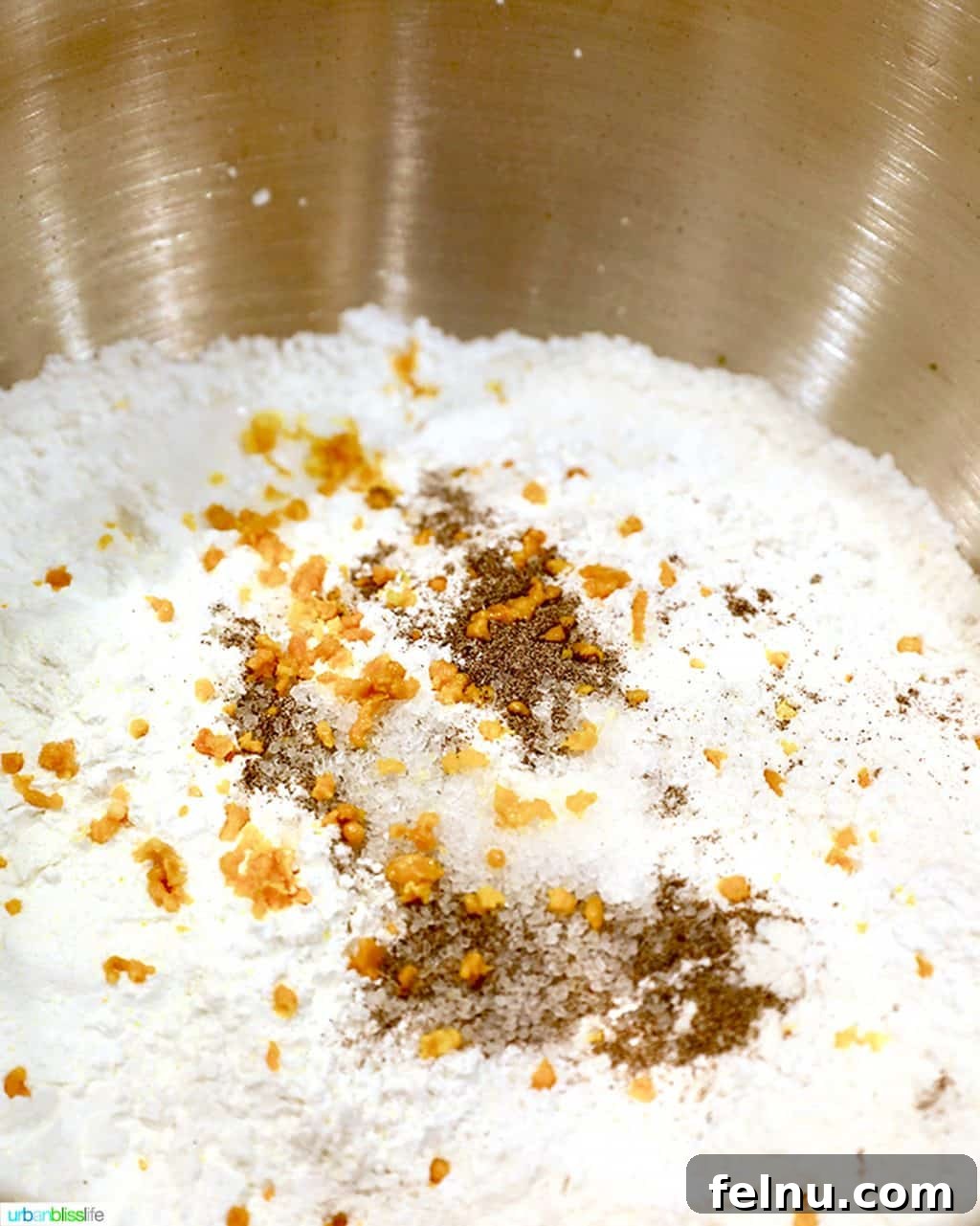 Overnight Orange Spice Rolls 5 A blend of dry ingredients, including orange zest and cardamom, ready to be incorporated into the cinnamon roll dough.