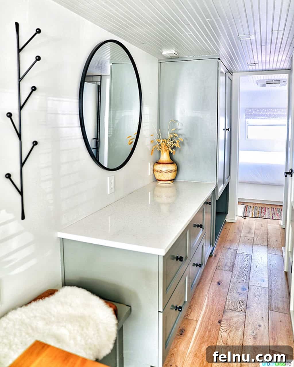 Glamping in Wine Country: Vintages Trailer Resort in Oregon's Willamette Valley 11 A bright and elegant hallway with integrated storage drawers inside the Royal Spartan Mansion airstream, demonstrating clever space utilization and sophisticated design.