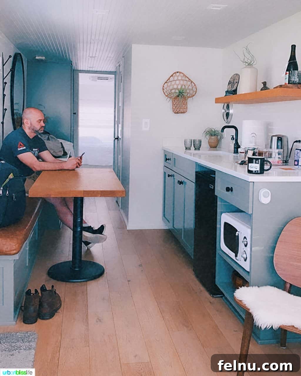 Glamping in Wine Country: Vintages Trailer Resort in Oregon's Willamette Valley 17 Alain Schotland enjoying the cozy interior of the mansion airstream at Vintages Trailer Resort, showcasing the comfortable and inviting atmosphere.