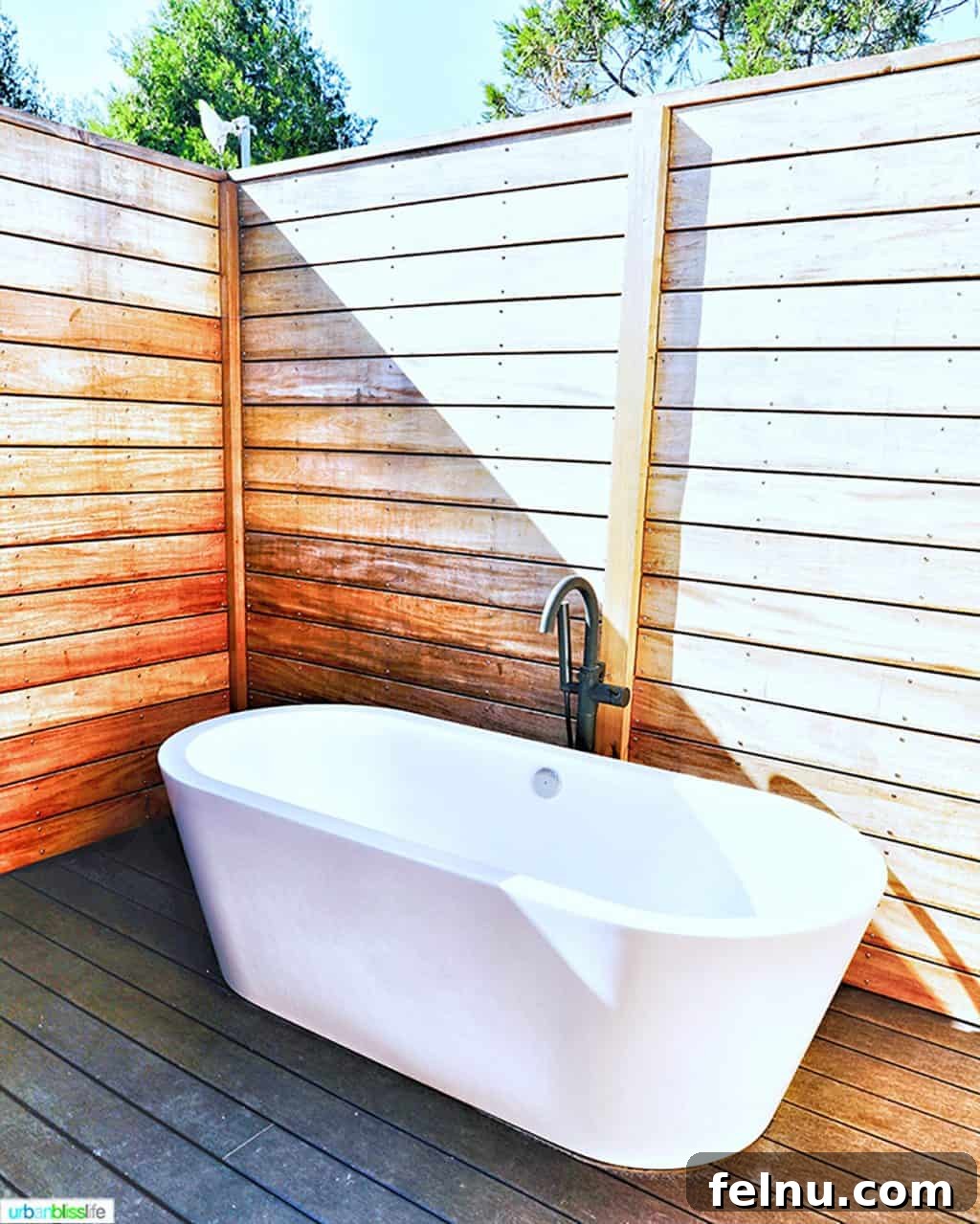 Glamping in Wine Country: Vintages Trailer Resort in Oregon's Willamette Valley 19 A large, inviting outdoor soaking tub on a private wooden deck, offering a luxurious and secluded relaxation spot at the Vintages Trailer Resort.