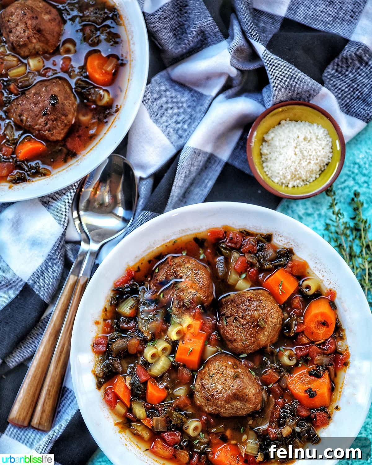 Hearty Slow Cooker Meatball Soup 3 Close-up of a bowl of slow cooker meatball soup, showing tender meatballs, carrots, pasta, and vibrant broth.