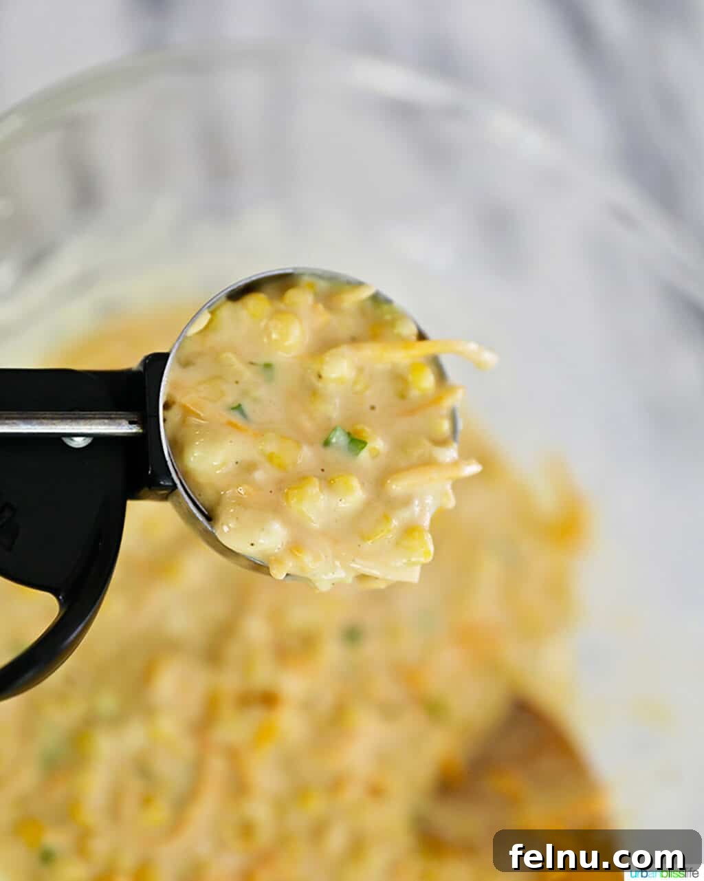 Golden Corn Fritters 8 Scoop of corn fritter batter, showing its readiness for frying.