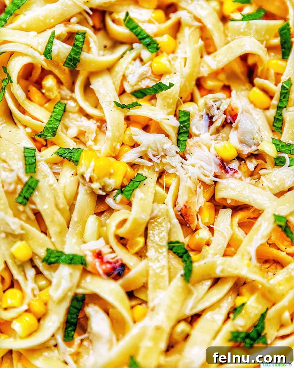 Zoomed-in view of pasta with crab and corn