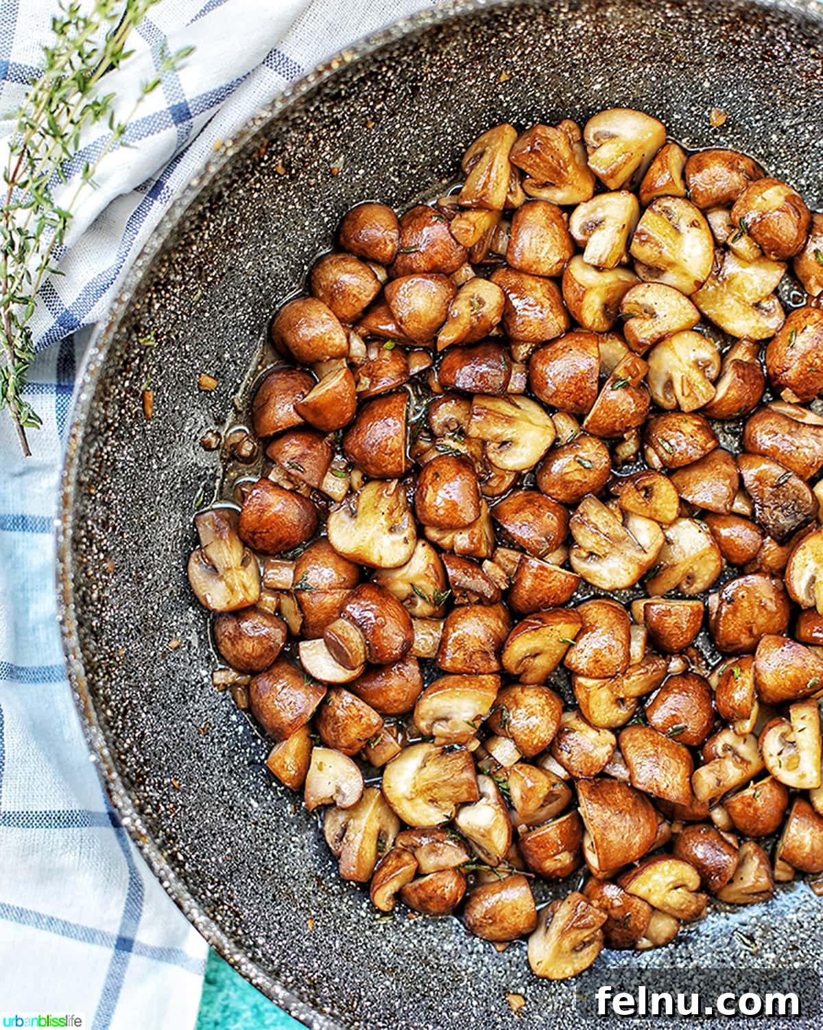 Savory Marsala Mushrooms 9 A half-filled pan of perfectly cooked Mushroom Marsala, showcasing the rich, dark glaze on the mushrooms