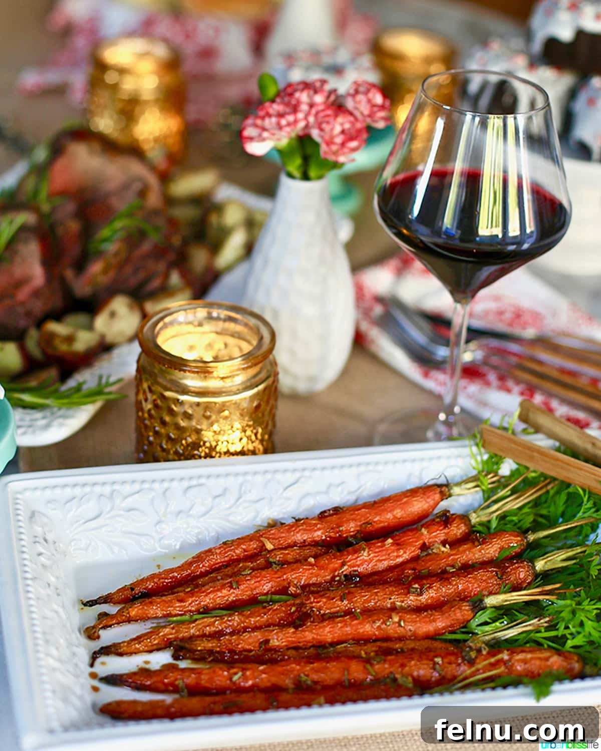 Garlic Rosemary Glazed Roasted Carrots 5 Roasted carrots on holiday table with wine