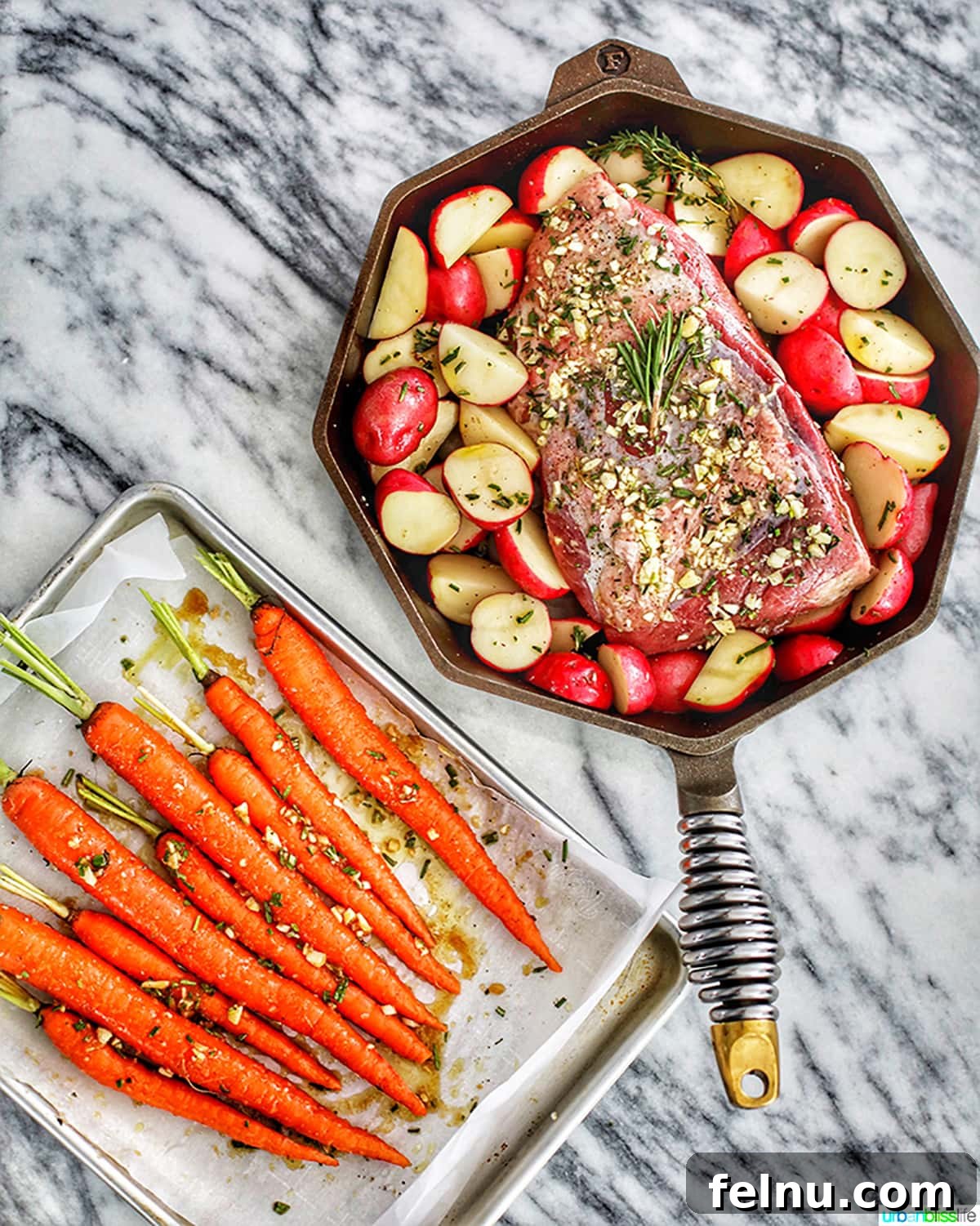 Garlic Rosemary Glazed Roasted Carrots 6 Carrots in baking sheet with beef roast and potatoes