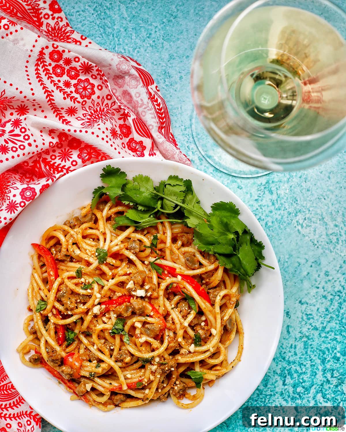 Thai Red Curry Pasta Fusion 9 Red Curry Pasta in a White Bowl with Wine